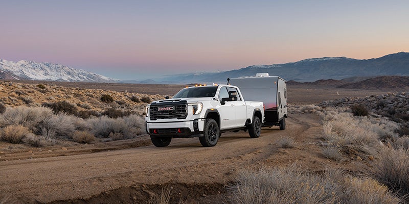 GMC Sierra HD pulling a trailer in the desert