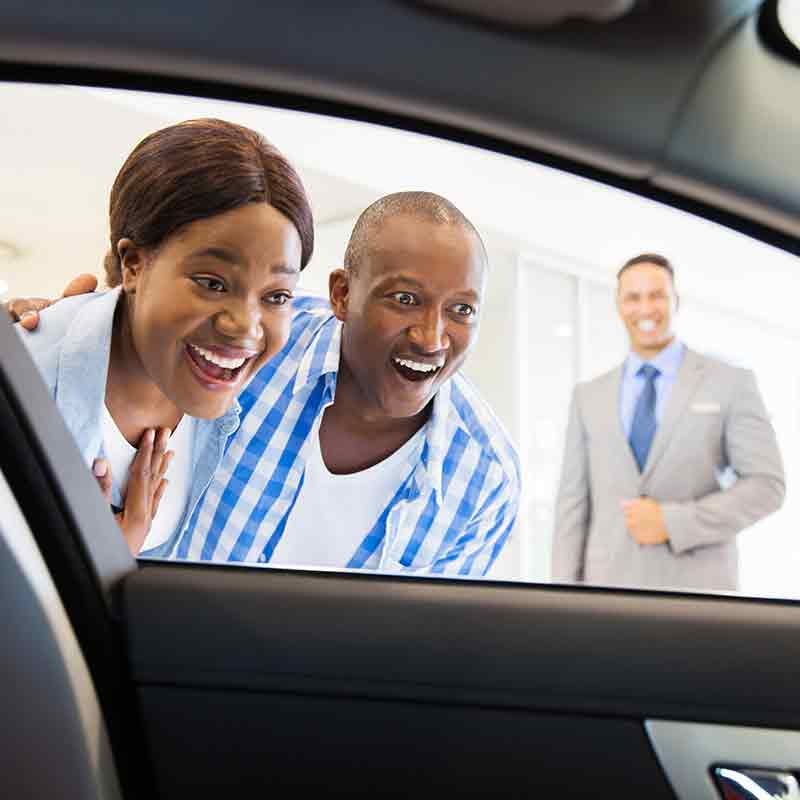 Plattner's Quincy GMC in QUINCY FL customers looking in new car